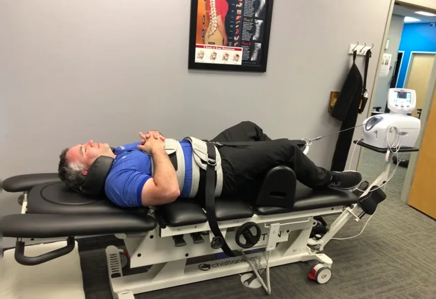 A patient receiving spinal decompression therapy at True North Chiropractic Center