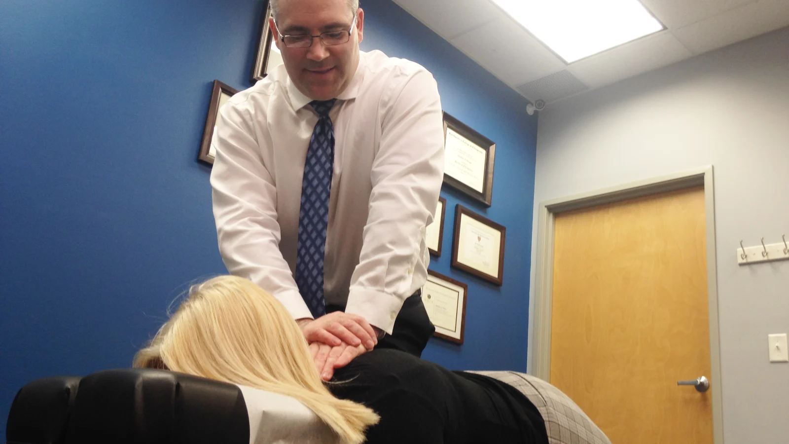Dr. Nathan Weiss performing a gentle chiropractic adjustment at True North Chiropractic Center in Thief River Falls