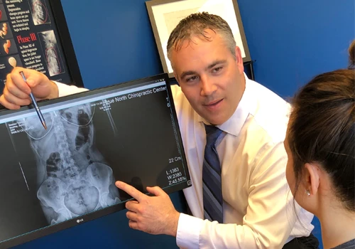 Dr. Nathan Weiss reviewing a patient's digital X-rays